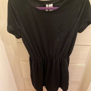 Black dress with front pocket and sinched waist